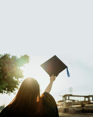 Close up selective focus of the university graduate celebrates graduation in commencement day after...