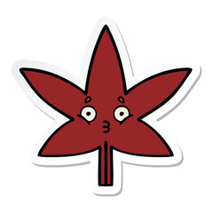 sticker of a cute cartoon autumnal leaf