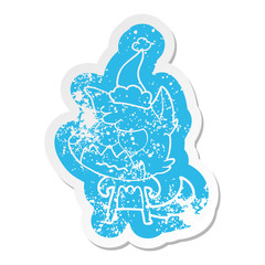 cartoon distressed sticker of a annoyed fox wearing santa hat