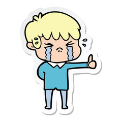 sticker of a cartoon boy crying