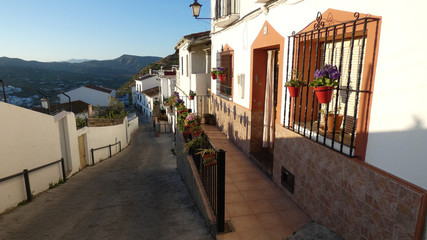 Steep street and front terrace in Andalusian village