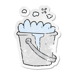 distressed sticker of a cartoon bucket of soapy water