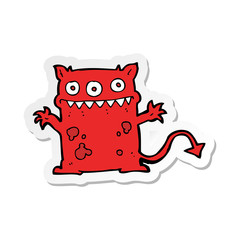sticker of a cartoon little monster