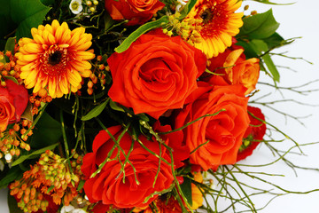 bunch of flowers with red roses