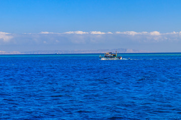Fishing trawler sails at Red sea in Hurghada, Egypt
