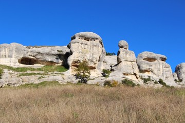 View of the Stone Sphinxes. This natural mountain range is located right near the old part of the city of Bakhchisarai on the Crimean peninsula. Some of this rocks looks like faces.