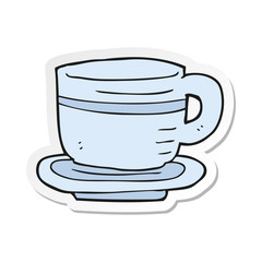 sticker of a cartoon cup and saucer
