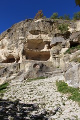 View on the cavetown Chufut-Kale in the autumn near Bakhchisarai city on the Crimean Peninsula. It'is a medieval city-fortress in the Crimean Mountains that now lies in ruins.