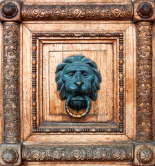 The carved ornament with the figure of a bronze lion in the center at the front door of the State Historical Museum on Red Square in Moscow. Historical landmark of Russian architecture.