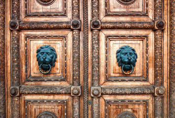 The carved ornament with the figure of a bronze lion in the center at the front door of the State Historical Museum on Red Square in Moscow. Historical landmark of Russian architecture.