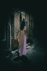 3D render of a female figure carrying suitcase walking in a dark alley