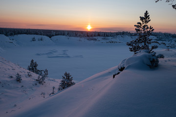Snowy Landscape with Field and Rising Sun or at sunset. Beautiful Winter Background