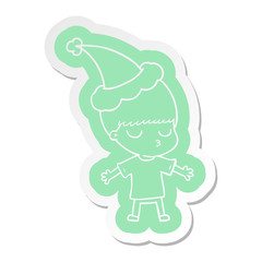 cartoon  sticker of a calm boy wearing santa hat