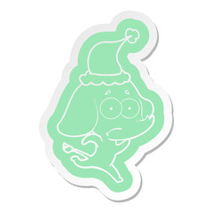 cartoon  sticker of a unsure elephant running away wearing santa hat