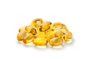 Pile of fish oil capsules isolated on white background