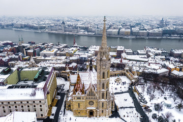 Budapest, Hungary - Aerial view of the famous snowy Matthias Church and Fisherman's Bastion with...