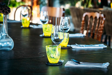 Wine glass with dining set prepare for breakfast lunch or dinner on table in restaurant