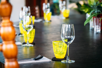 Wine glass with dining set prepare for breakfast lunch or dinner on table in restaurant