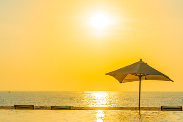 Beautiful landscape outdoor swimming pool with umbrella and deck chair in hotel resort for relax travel and vacation