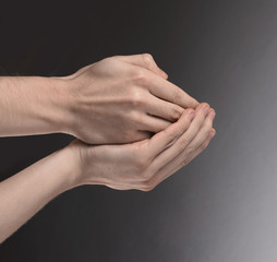 two palms put together. isolated on gray background