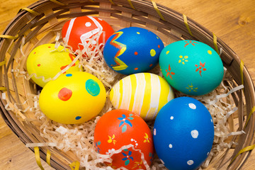 easter eggs on wooden background, top view