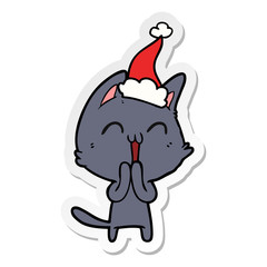 happy sticker cartoon of a cat wearing santa hat