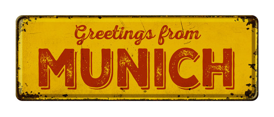 Fototapeta premium Vintage metal sign on a white background - Greetings from Munich