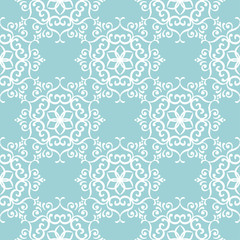 Floral seamless background. White pattern on blue backdrop