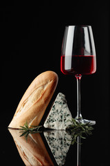 Blue cheese with bread, rosemary and wine.