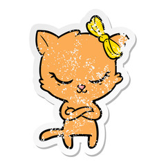 distressed sticker of a cute cartoon cat with bow