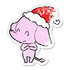 cute distressed sticker cartoon of a elephant wearing santa hat