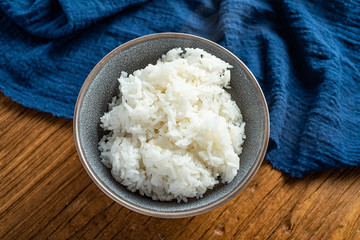 a bowl of white rice on the table