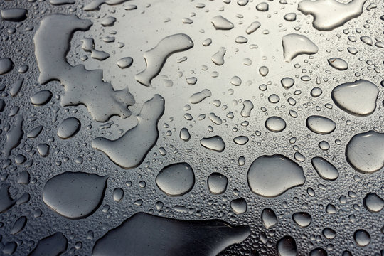 Scratched Stainless Steel Background with Water Drops