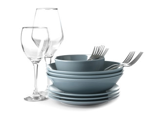 Set of clean dishes on white background