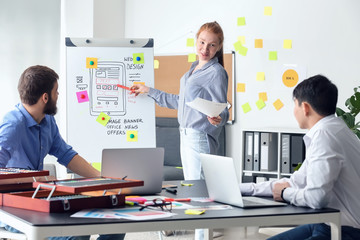 Young IT designers working in office