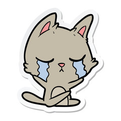 sticker of a crying cartoon cat