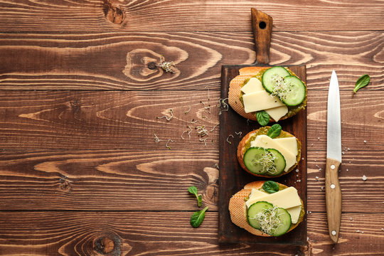 Fresh tasty bruschettas on wooden table