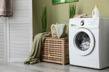 Interior of home laundry room with modern washing machine - obrazy, fototapety, plakaty