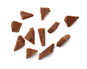 Pieces of tasty milk chocolate on white background