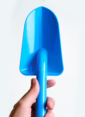 Photo Blue shovel in hand