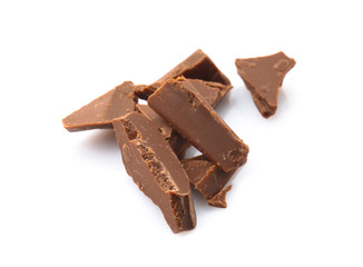 Pieces of tasty milk chocolate on white background