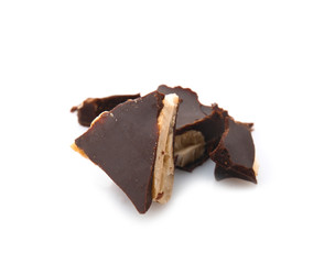 Pieces of tasty chocolate on white background