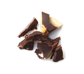 Pieces of tasty chocolate on white background