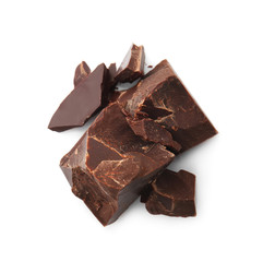 Pieces of tasty dark chocolate on white background