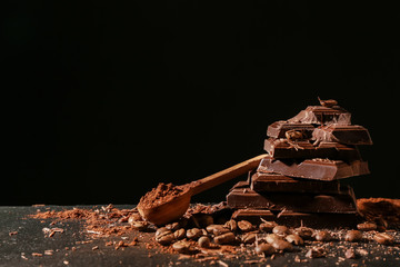 Sweet tasty chocolate on dark background