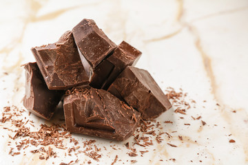 Sweet tasty chocolate on light background