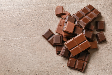Sweet tasty chocolate on light background