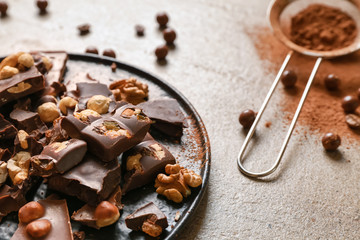 Sweet tasty chocolate with nuts on plate