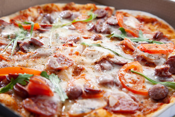  Tasty round baked pizza close-up. Fast food.