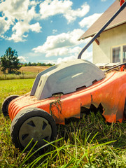 Person mowing green grass